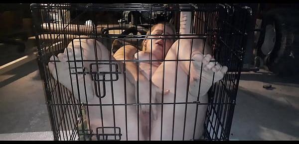  My sex slave plays with herself while locked inside cage
